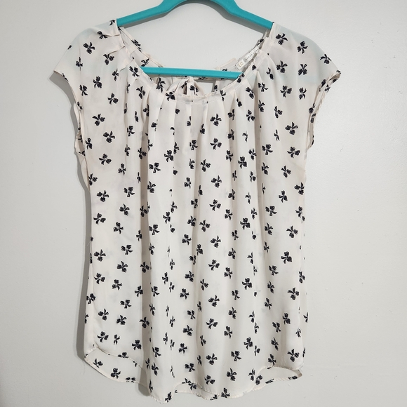 LC Lauren Conrad Tops - LC Lauren Conrad Cream Blouse with Black Bow Pattern, size M